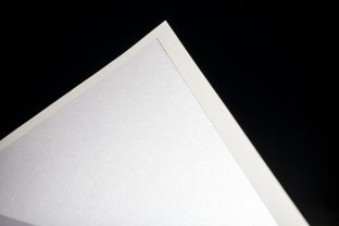 Metallic glass envelope liners from smock