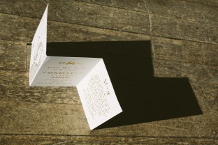 Custom gold foil stamped tri-fold save the dates from Smock