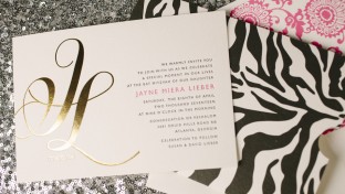 Finley gold foil stamped Bat Mitzvah invitations with zebra striped invitation sleeves