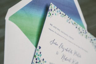 Custom sea glass inspired wedding invitations from Smock with custom watercolor envelope liners