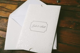 Pearl shine foil stamped wedding invitations and invitation sleeves from Smock