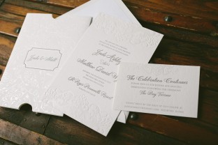 Pearl shine foil stamped wedding invitations and invitation sleeves from Smock