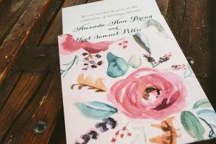 Custom letterpress wedding invitations + watercolor floral invitation sleeves from Smock