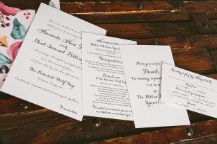 Custom letterpress wedding invitations + watercolor floral invitation sleeves from Smock