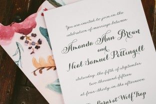 Custom letterpress wedding invitations + watercolor floral invitation sleeves from Smock