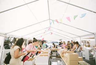 Shoppers stocking up on product at the 2016 Smock Sidewalk Sale