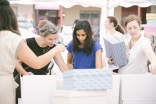 Shoppers stocking up on product at the 2016 Smock Sidewalk Sale