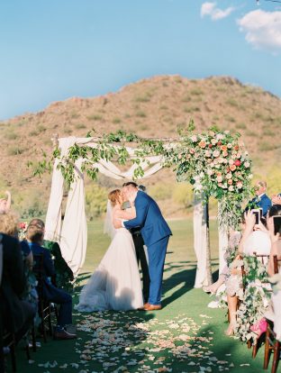 Romantic real wedding ceremony + floral arch at the Silverleaf in Scottsdale, Arizona | Photos by Rachel Solomon Photography