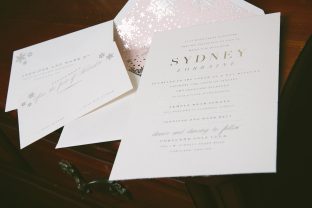 Silver foil stamped wedding invitations with snowflake envelope liner from Smock