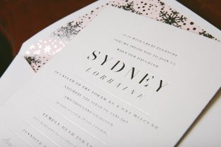 Silver foil stamped wedding invitations with snowflake envelope liner from Smock