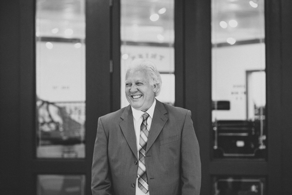 Johnny Oates of Cotton and Pine is all smiles in from of his shop.